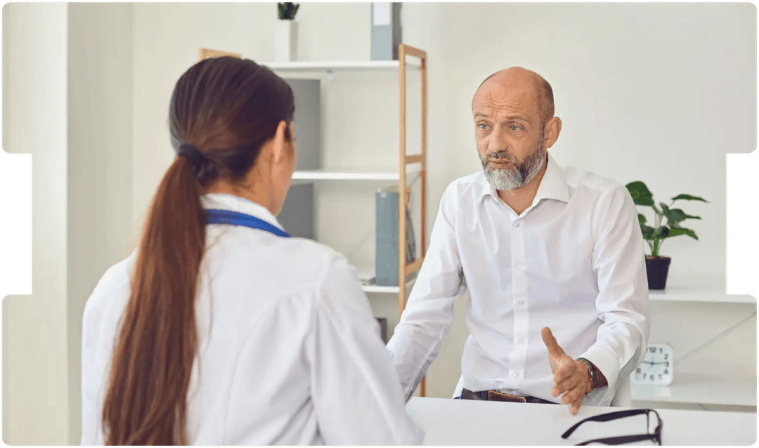 Concerned patient discussing symptoms with a neurologist, highlighting the importance of early diagnosis in functional neurological disorder (FND).