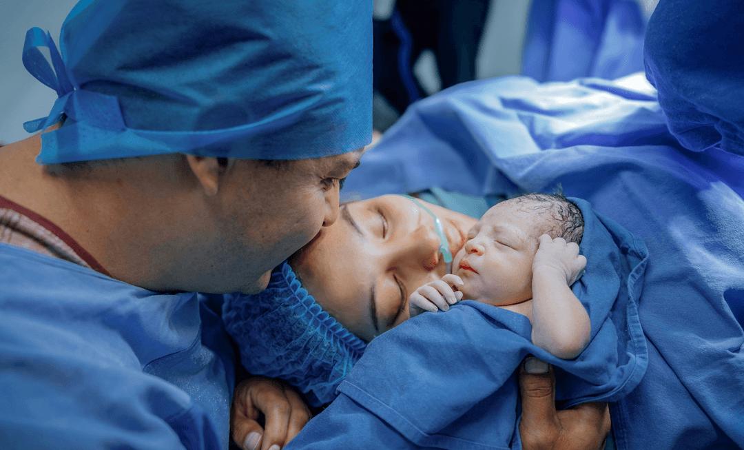 Mother holding her newborn in hospital, symbolising early bonding and awareness of Group B Streptococcal infection risks in newborns.