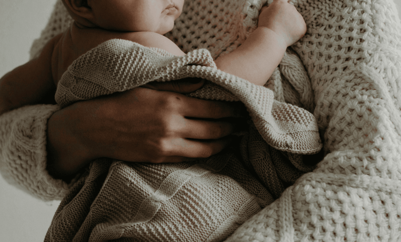 INNEG-Maturnity-Birth-Injury-Claim-Woman-Holding-Baby