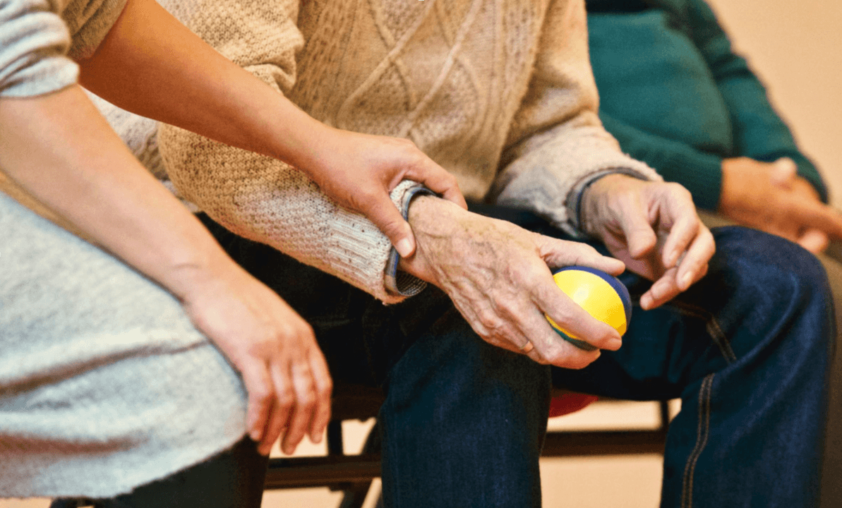 old man, stressed, holding stress ball, INNEG