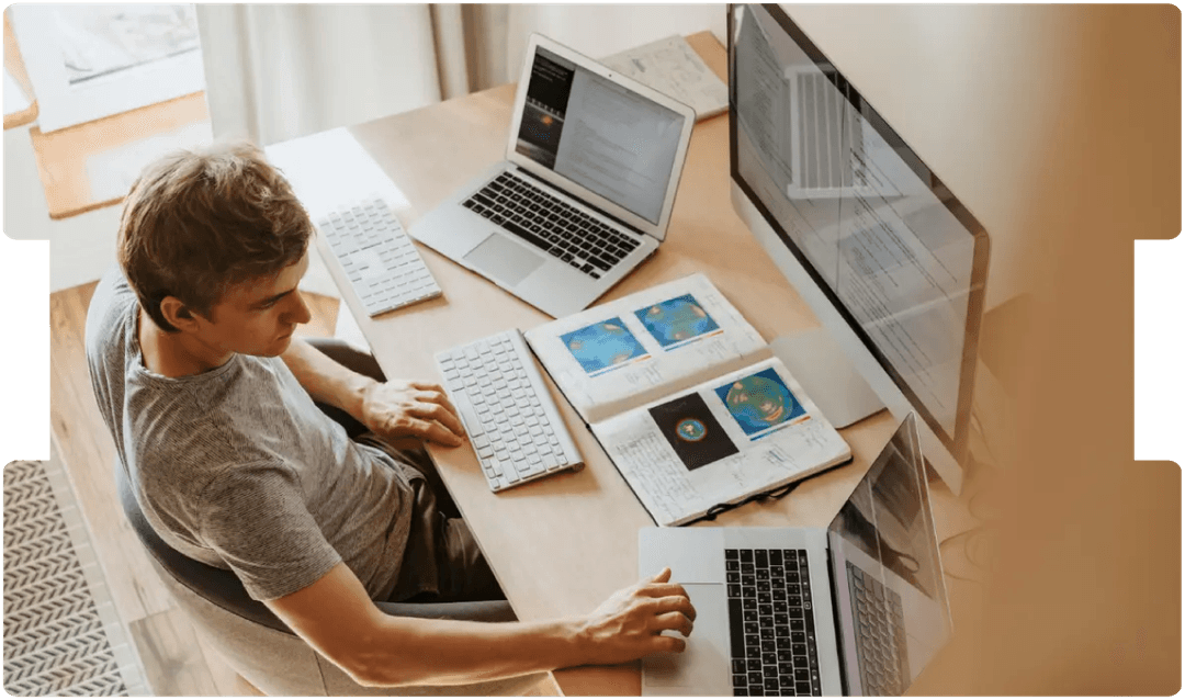Smiling doctor using a smartphone and laptop, representing the growing role and medico-legal considerations of virtual medical consultations.