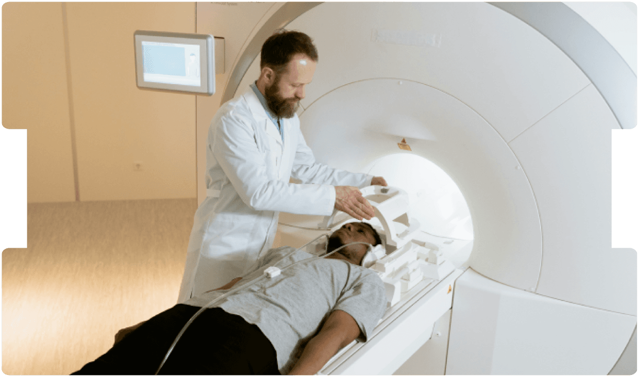 Clinician prepares a patient for an MRI scan, offering calm support and precise diagnostic imaging care.