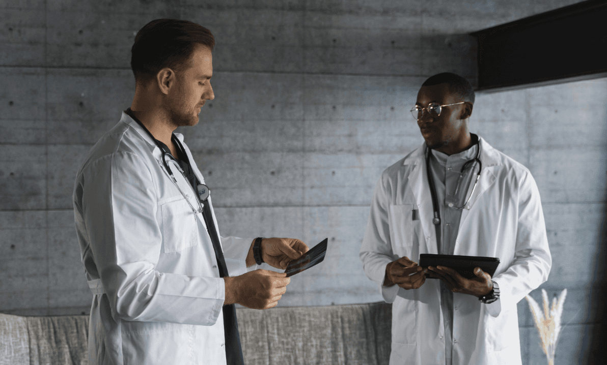 two-male-doctors-holding-xray