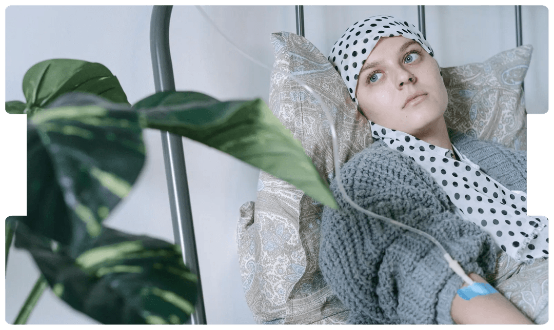 Woman undergoing IV treatment while resting, reflecting the disruption and challenges faced by cancer patients during the COVID-19 pandemic.
