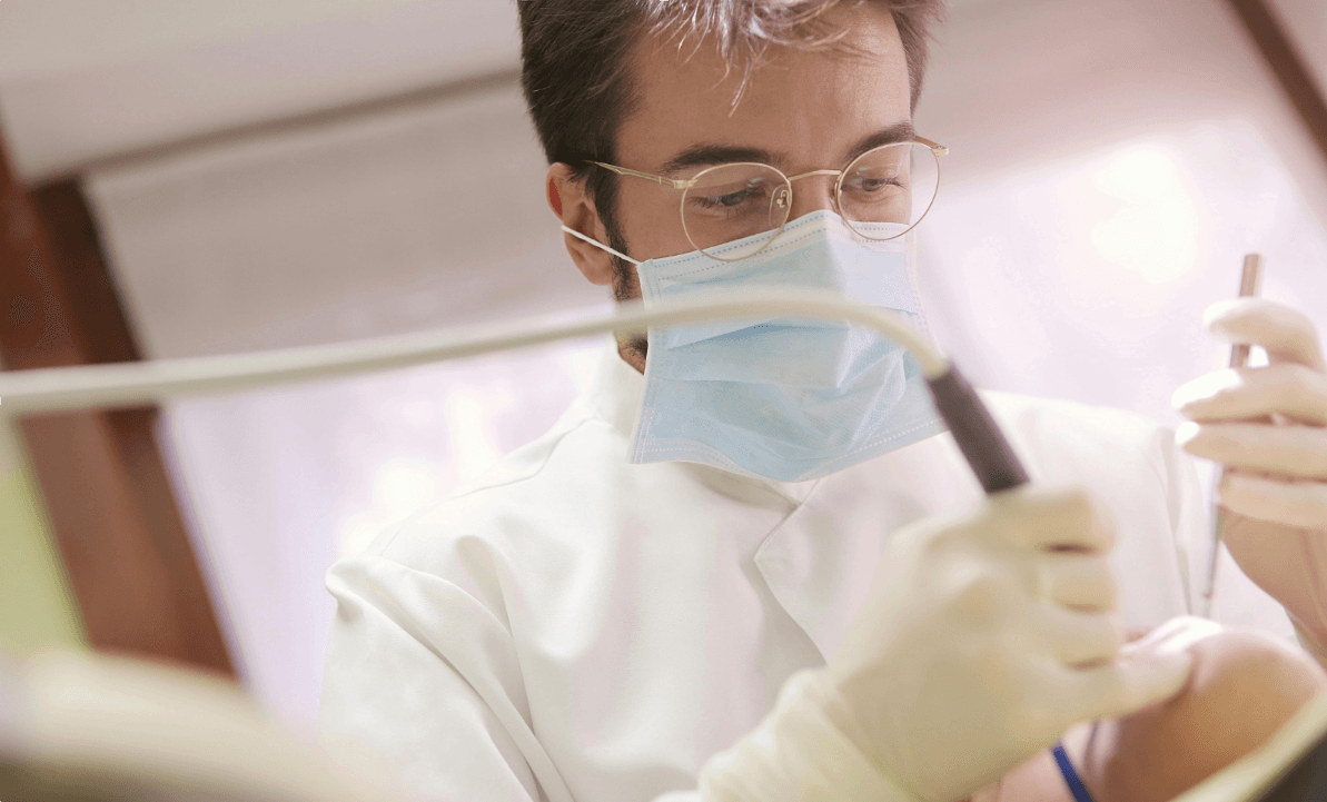 dentist image, performing surgery