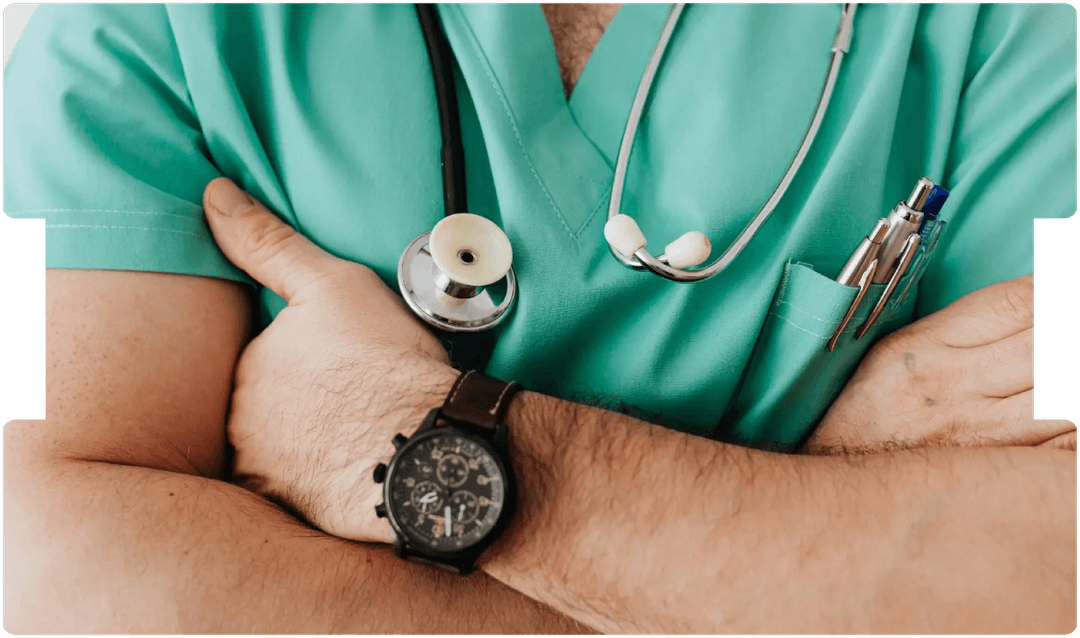 Doctor in scrubs with arms crossed, representing healthcare costs and medical service expenses.