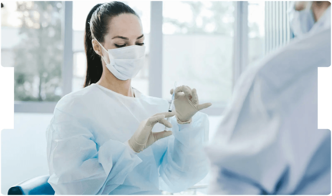Medical professional preparing an injection, symbolising precision and reform amid discussions on fixed costs in clinical negligence cases.