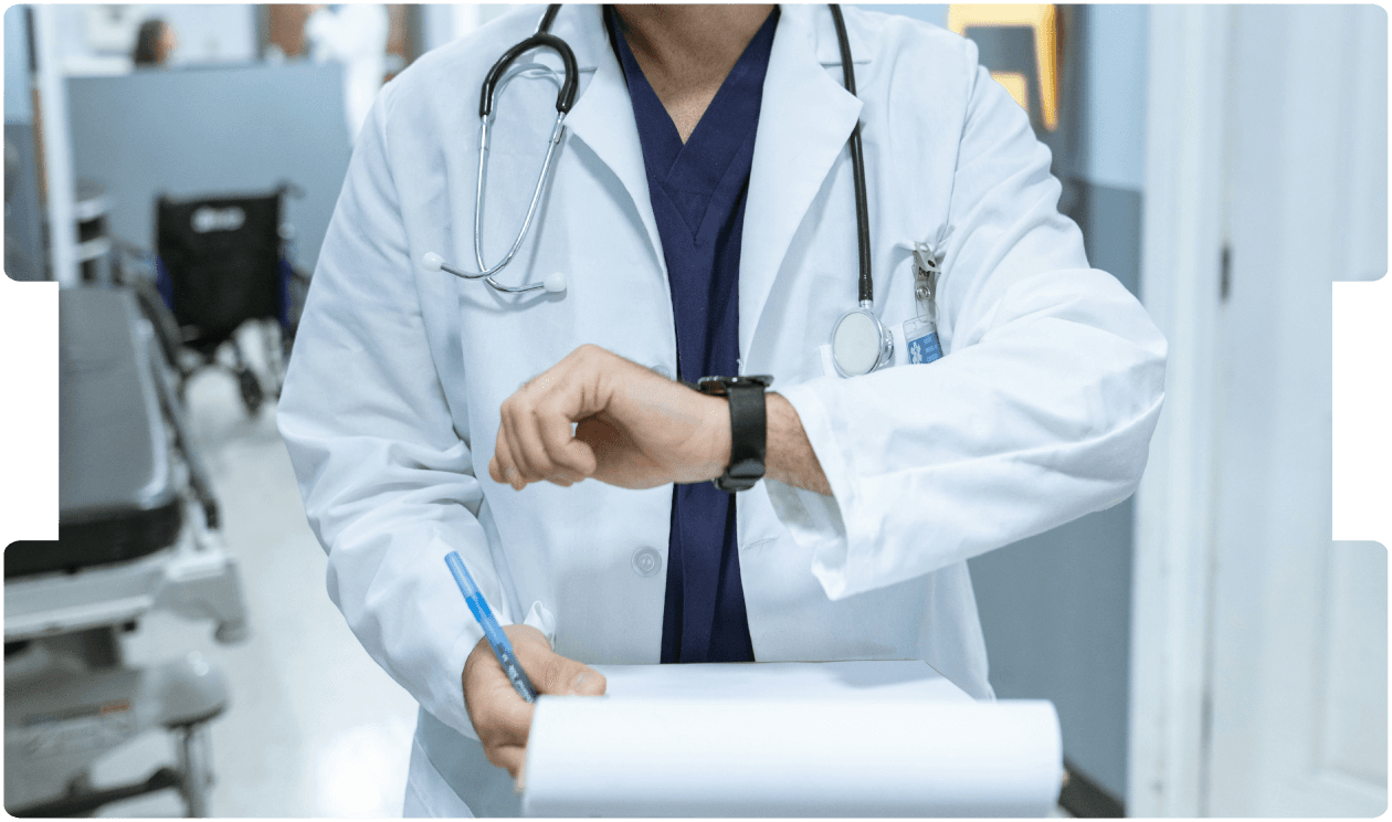 Healthcare professional handling medication at a workstation, representing the risk of misprescribing drugs.