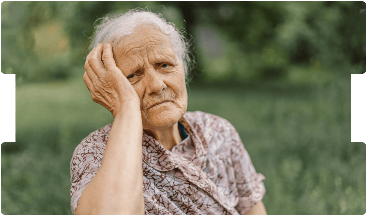 Elderly woman sitting, representing ulcer prevention and management in older adults.