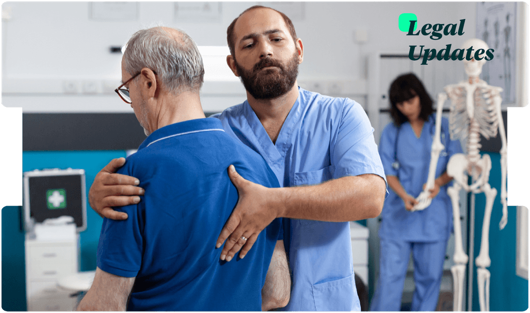 Physiotherapist supports an older man during a back mobility exam, reflecting careful medical assessment for injury claim legal updates.