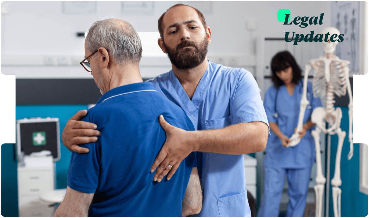 Physiotherapist supports an older man during a back mobility exam, reflecting careful medical assessment for injury claim legal updates.