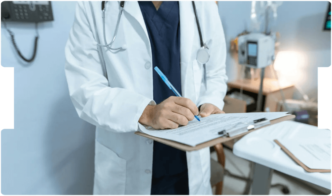 Doctor writing notes on a clipboard in a hospital room, representing the importance of selecting the right medico-legal expert for each case.