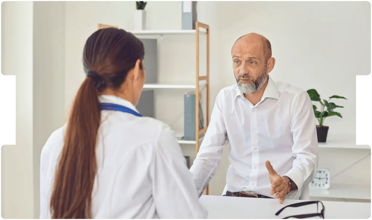 Concerned patient discussing symptoms with a neurologist, highlighting the importance of early diagnosis in functional neurological disorder (FND).