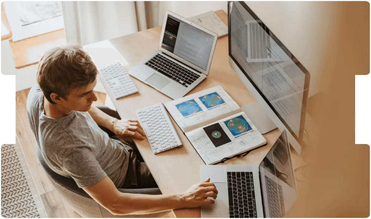 Smiling doctor using a smartphone and laptop, representing the growing role and medico-legal considerations of virtual medical consultations.