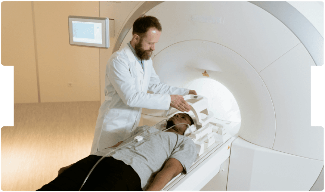 Clinician prepares a patient for an MRI scan, offering calm support and precise diagnostic imaging care.