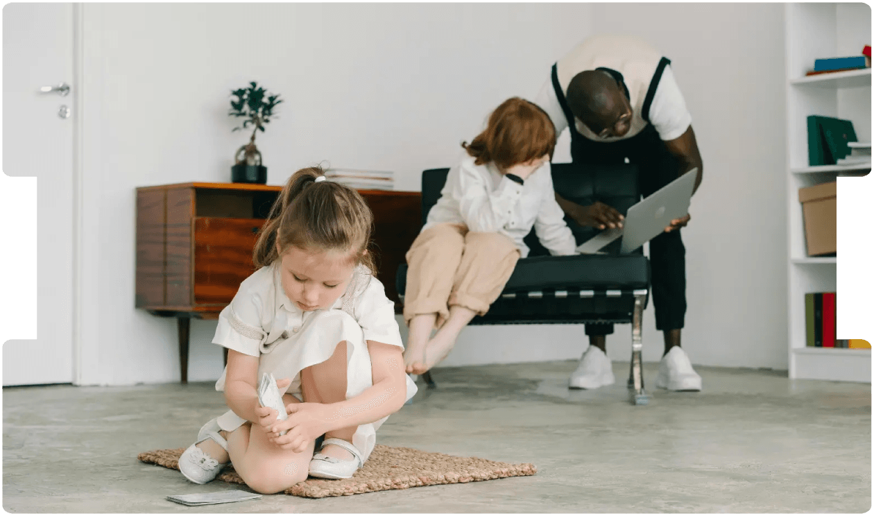 Young girl playing while adults work nearby, symbolising awareness of autism, trauma, and neurodivergence in personal injury assessments.