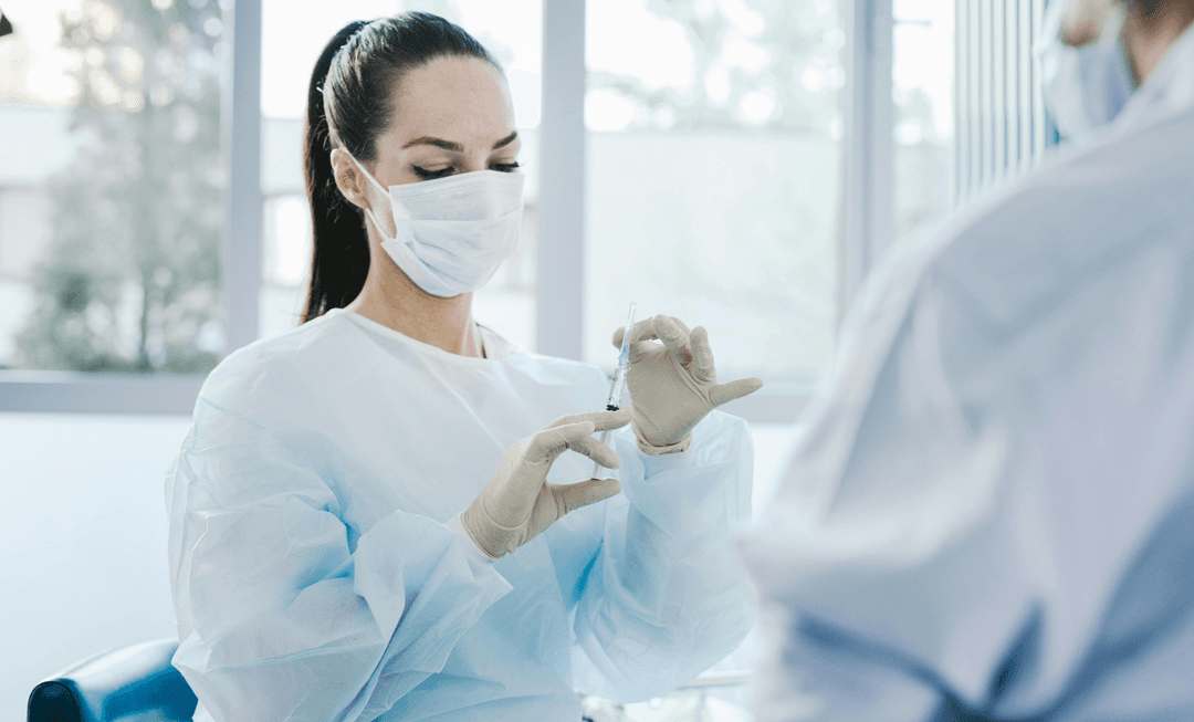 Medical professional preparing an injection, symbolising precision and reform amid discussions on fixed costs in clinical negligence cases.