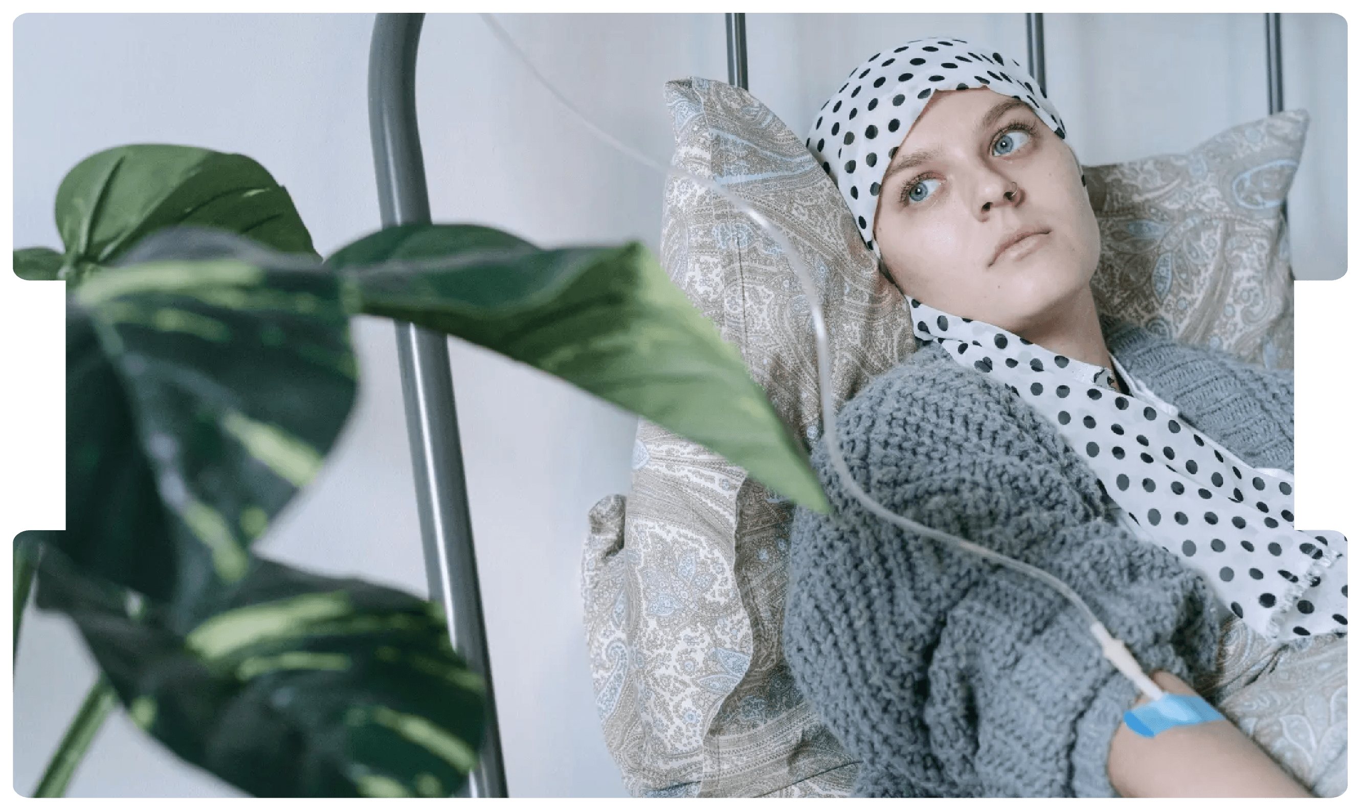 Woman undergoing IV treatment while resting, reflecting the disruption and challenges faced by cancer patients during the COVID-19 pandemic.